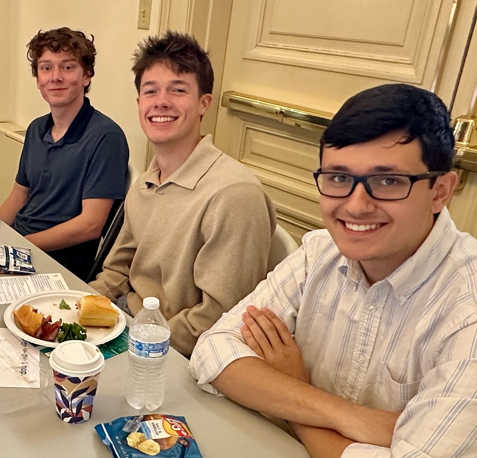 Young men sharing a meal together